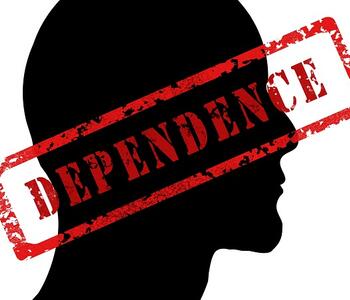 Head outline with the stamp "dependence" over it