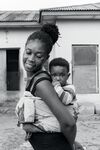 Mother Carrying Her Child