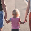 Parents With Child Holding Hands