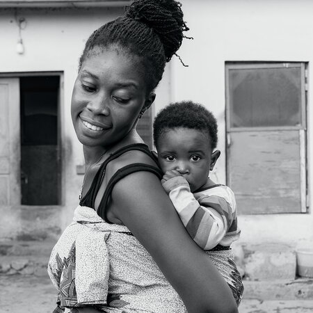 Mother Carrying Her Child