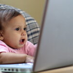 Baby Looking at a Laptop