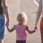Parents With Child Holding Hands